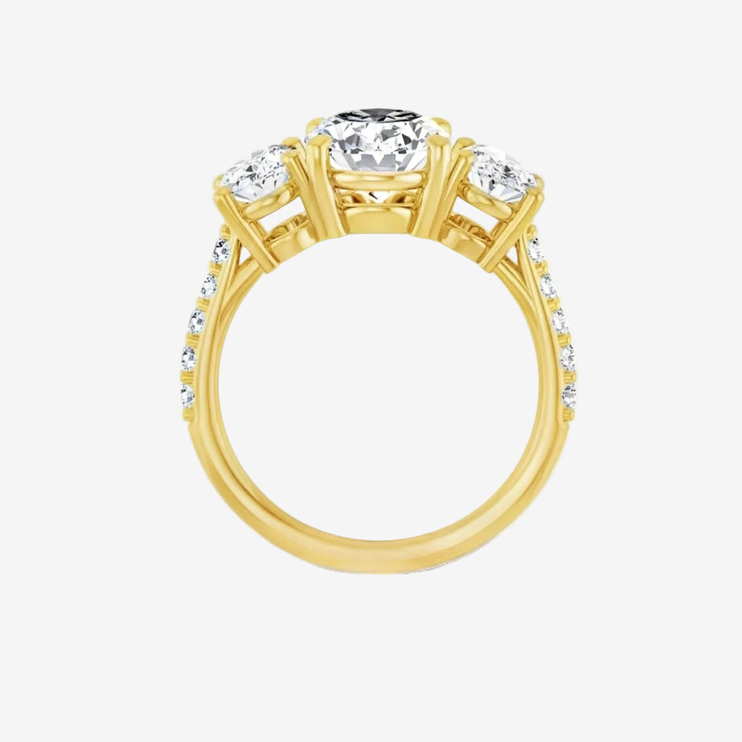 Gold ring with a central diamond and smaller diamonds on the side.