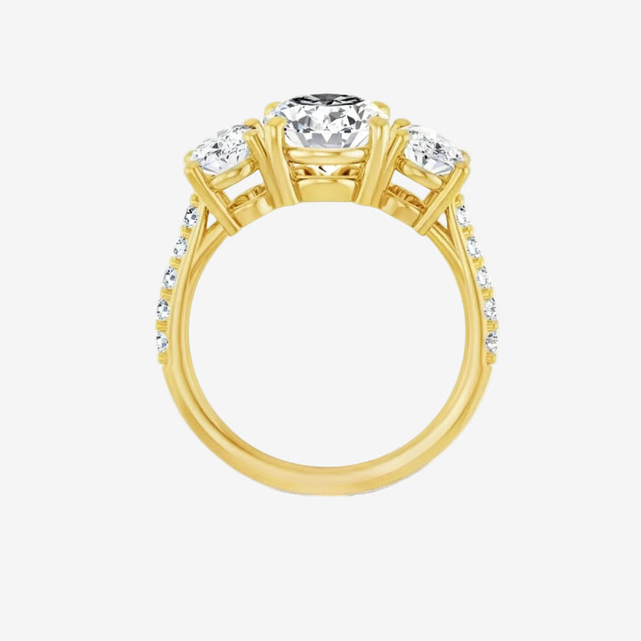 Gold ring with a central diamond and smaller diamonds on the side.