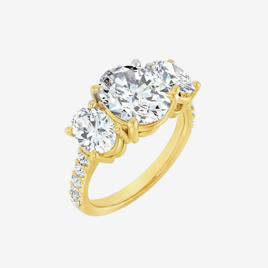 Gold ring with two clear gemstones.