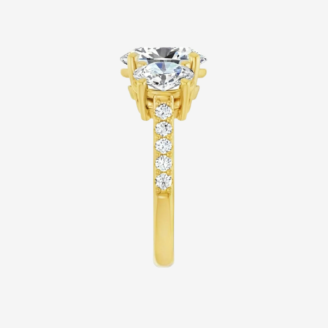Gold ring with a large central diamond and smaller diamonds on the band. 