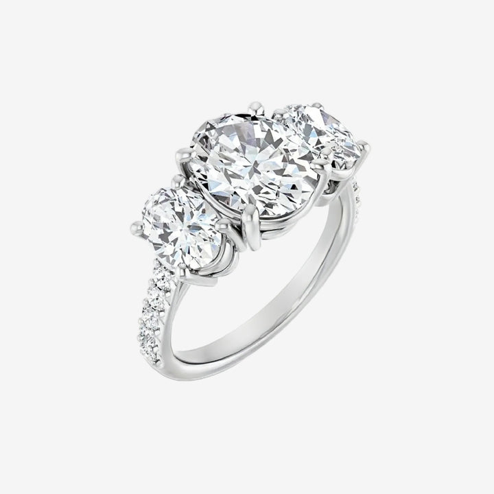 Oval Laboratory diamond ring with three transparent gemstones.