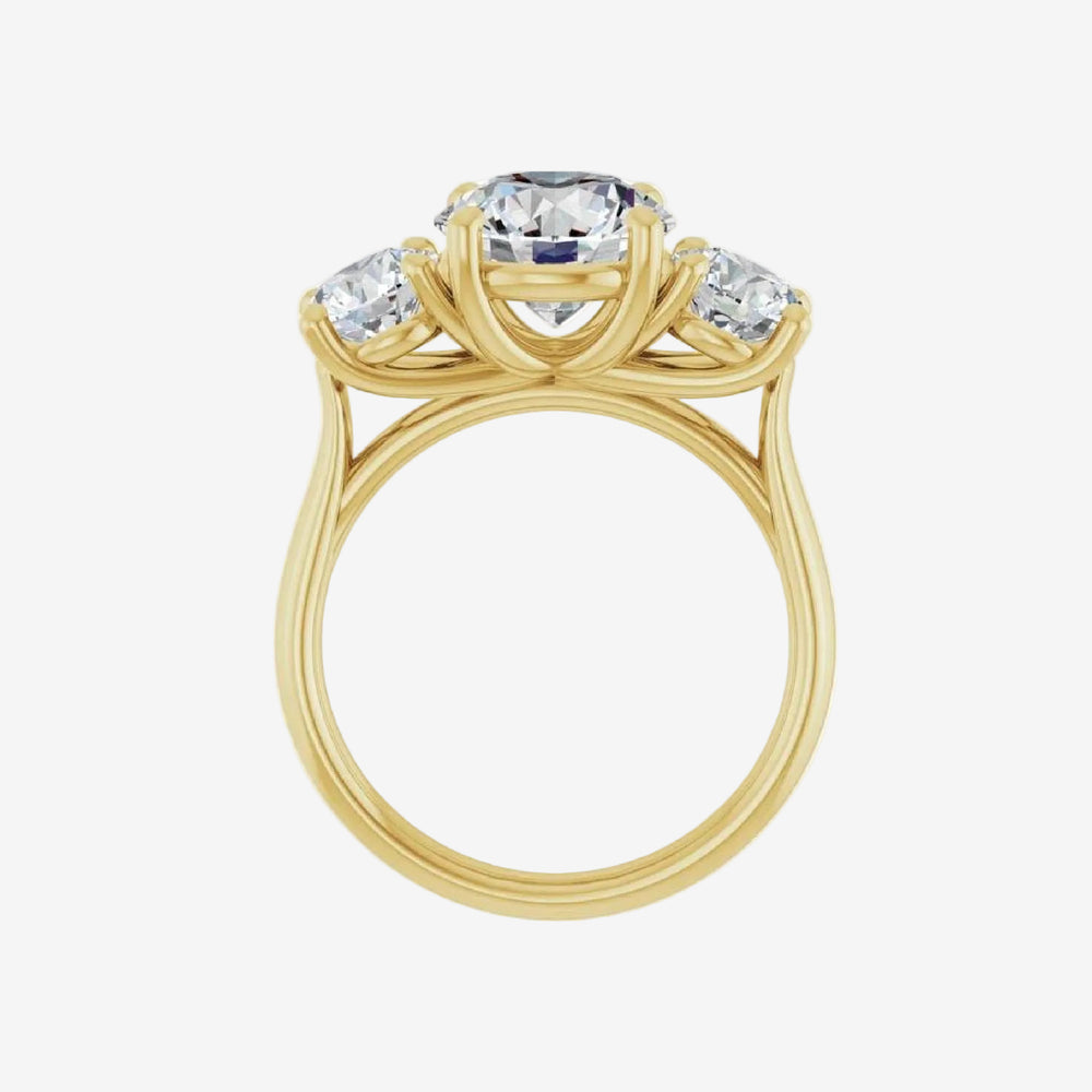 Gold ring with a central round diamond and two smaller oval diamonds on a white background