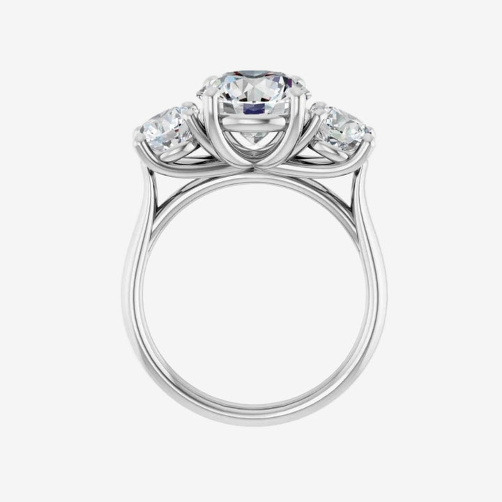 Diamond White Gold ring with three circular diamonds on a white background
