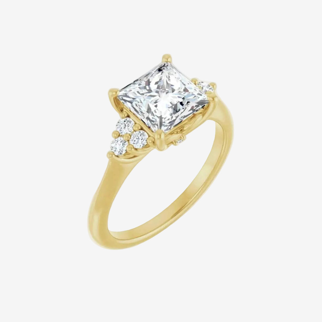 Gold ring with a large diamond and smaller diamonds.
